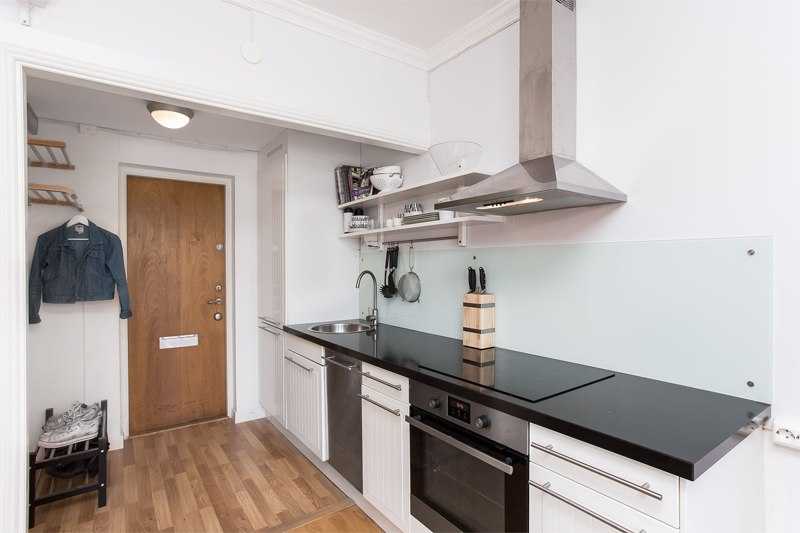 Кухня в коридоре (49 фото): тонкости переноса кухни в коридор и дизайн ее интерьера. оформление прихожей, переходящей в кухню